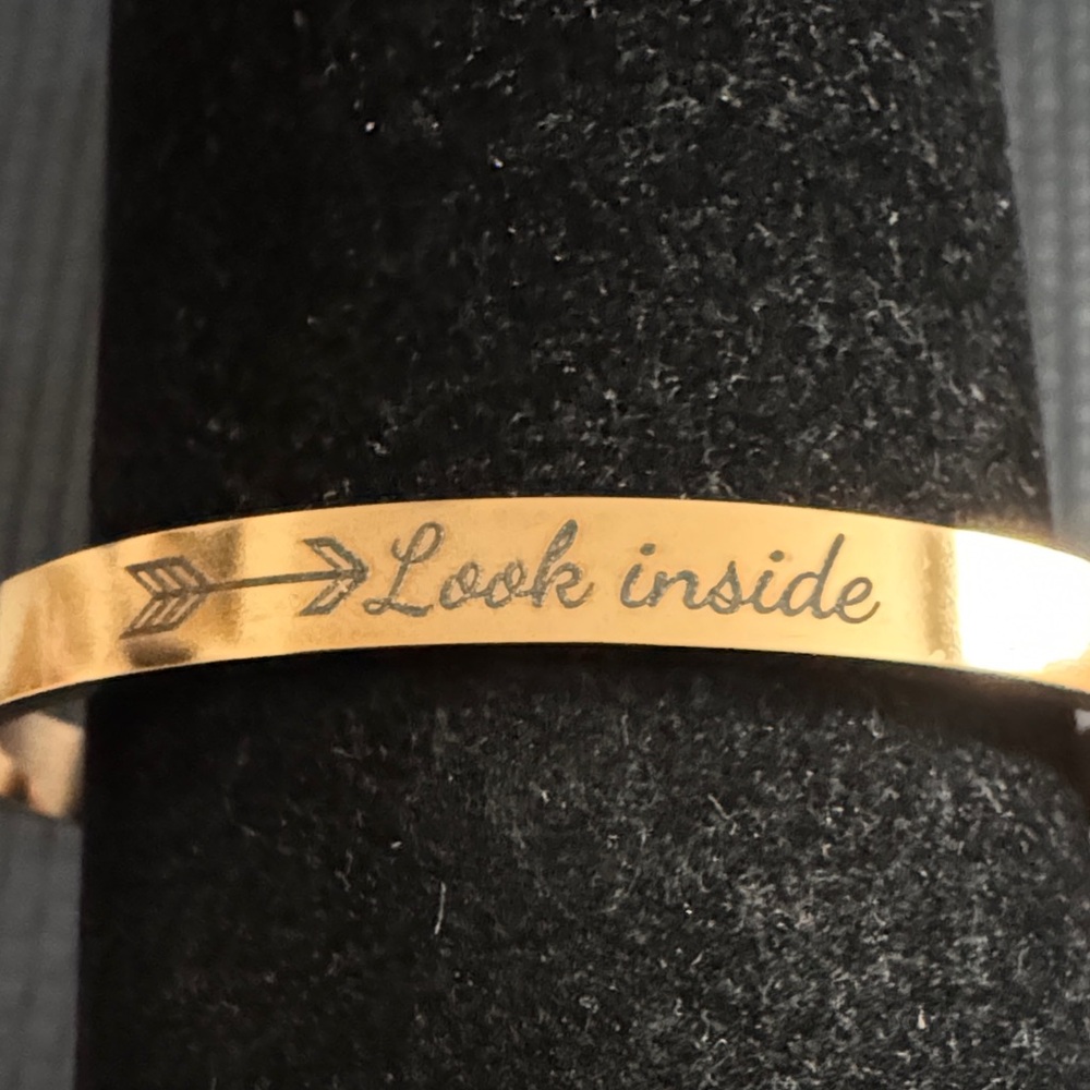 Gold Engraved Bracelet with engraved messages.